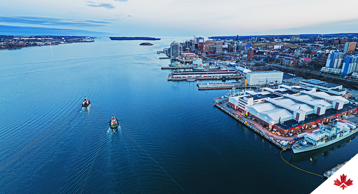 Aerial view of the Halifax Harbour with two tugboats.