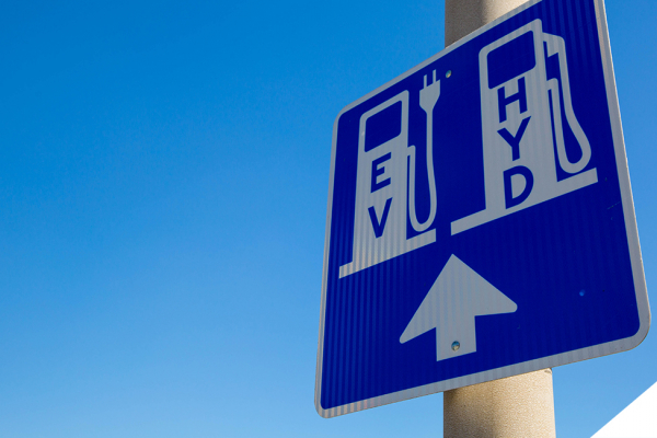 street sign indicating electric and hydrogen stations ahead