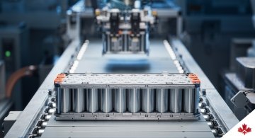 Silver EV batteries in a factory setting.