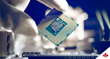 Semiconductor chipset held in the hand of a lab technician. 