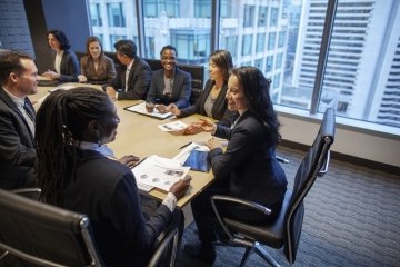 Diverse business professionals collaborating in a modern office.